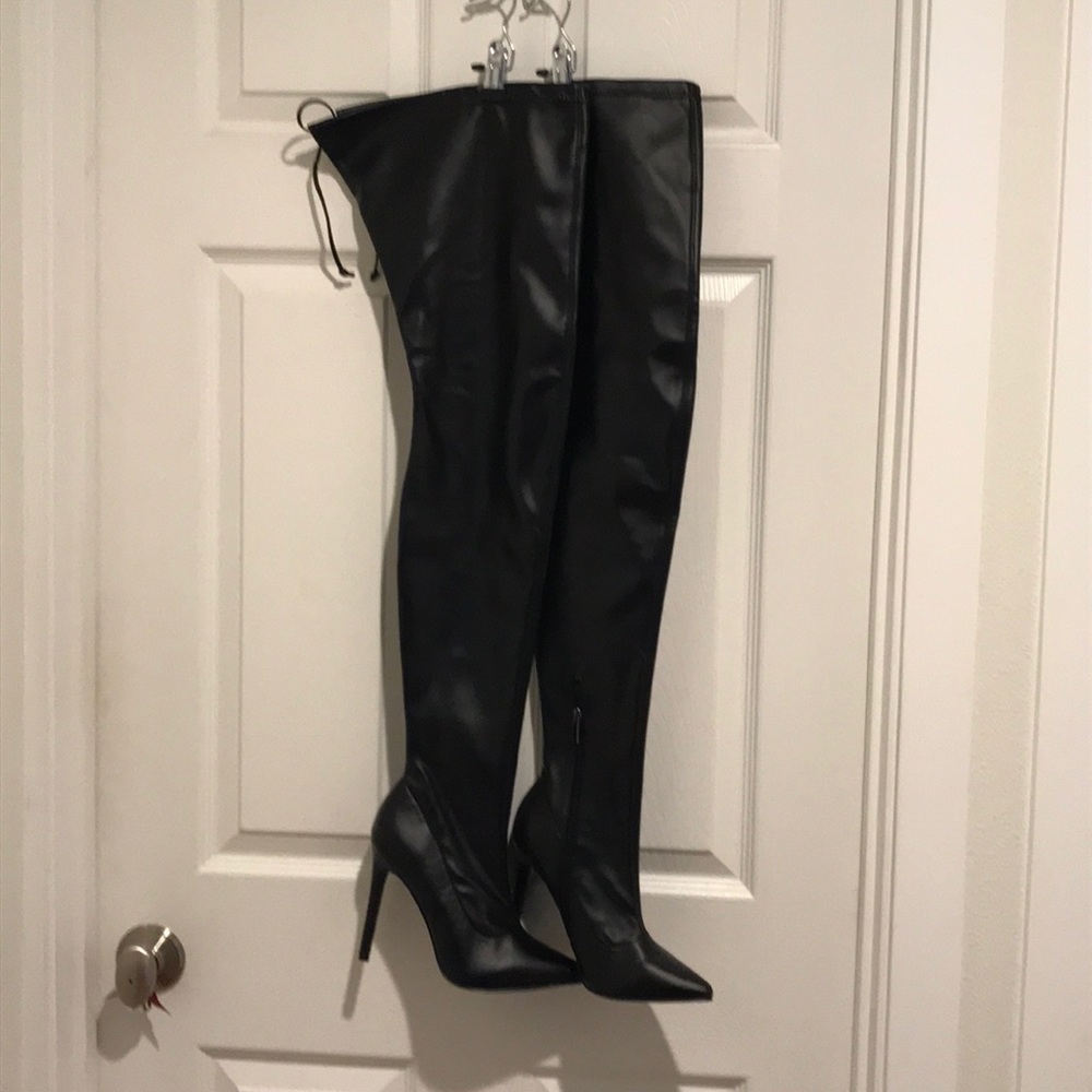 Black leather thigh high boots